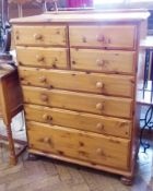 A modern pine chest of four short and four long drawers on bun feet, 85cm wide and a toilet