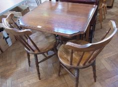 An antique oak dropleaf table, on shaped supports united by stretchers and pair stickback kitchen