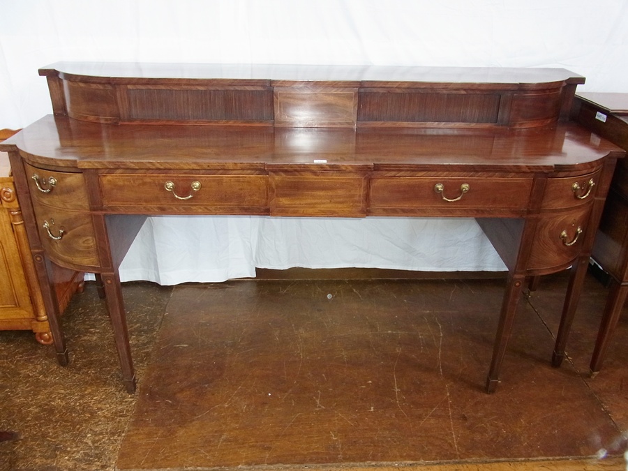 George III mahogany sideboard having raised break-front top with pair sliding tambour doors, cross-