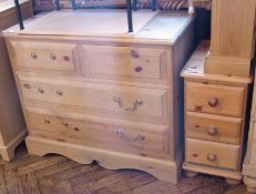 A pine chest of two short and two long drawers, with brass swan-neck handles on bracket feet, 85cm