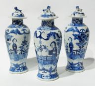 A set of three Chinese blue and white porcelain vases with covers, with dog of Fo finial, the