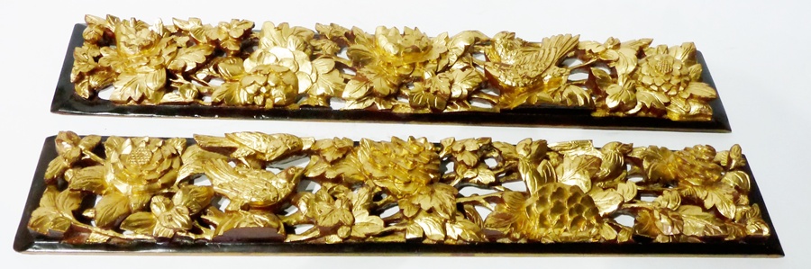 Pair gilt and carved wooden panels, each pierced and relief decorated with floral branches and