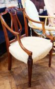 Edwardian satinwood open armchair, with carved back, green upholstered stuffover seat, on reeded