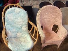 A modern wicker armchair in pink and a cane conservatory armchair (2)