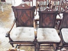 Pair of mid-20th century oak carvers open arm chairs, slat back with stuffover seat on tapering