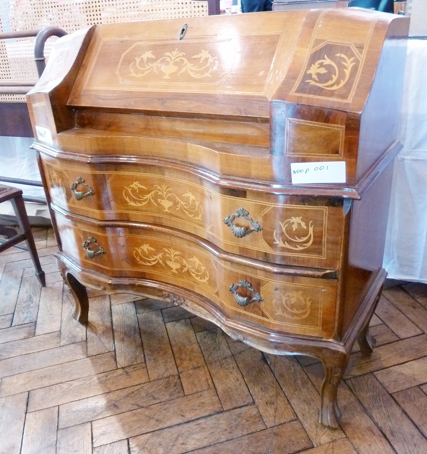 A reproduction walnut bureau, with inlaid decoration, fall-front enclosing an assortment of