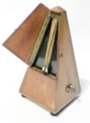 French metronome in stained wood case with turned pad feet
