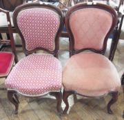 A pair of Victorian mahogany bedroom chairs, with padded back and seat on cabriole supports (2)