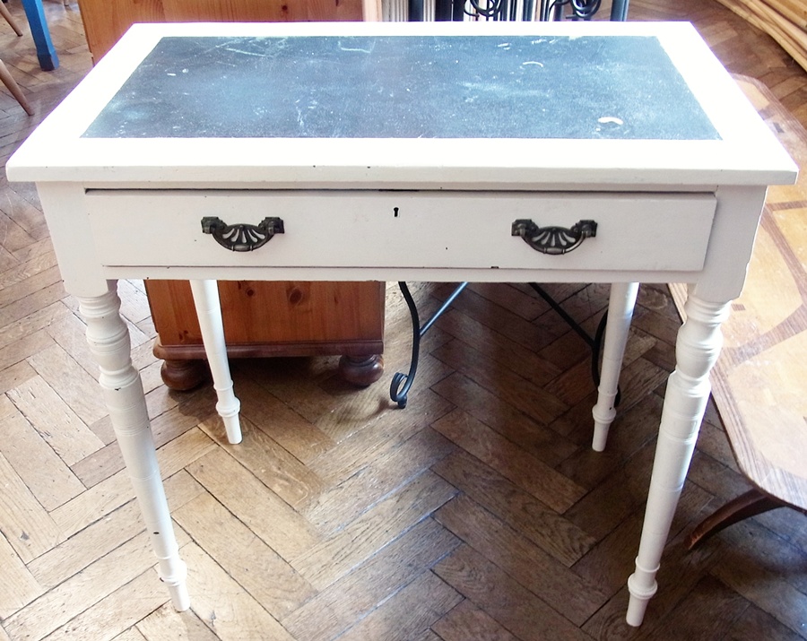 A painted pine writing desk, with inset top, single frieze drawer with brass handles, on turned