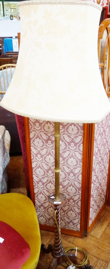 A rosewood and brass standard lamp, with cream shade, brass column, spiral cabriole support