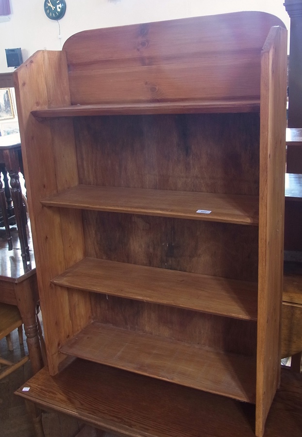 A stained hardwood four-tier bookcase, rectangular oak table, wine rack and a modern four-fold