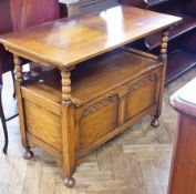 An antique oak monk's bench, with slide top, hinged, lidded seat, carved, panelled front on bun