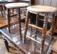 Pair antique oak bar stools, circular with turned supports, united by stretchers (2)