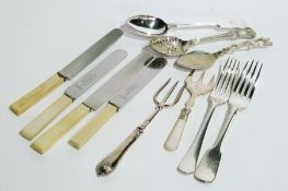 Large quantity plated table flatware including green handled knives, bread forks, jam spoons and