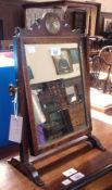 Georgian inlaid mahogany toilet mirror, the rectangular plate with scroll shaped pediment, chequered