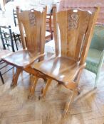Pair carved oak hall chairs, each with lion rampant shield to the panelled back, panel seat on