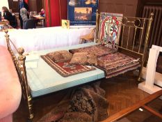 A brass double bedstead, with open rail head and tail boards on castors, 153cm wide