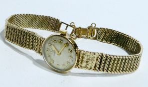 Lady's 9ct gold Omega wristwatch, the circular champagne-coloured dial, integral mesh bracelet