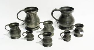 Two pewter measures, four smaller pewter mugs and two miniature pewter mugs (8)