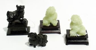 Pair modern Oriental jade style miniature temple dogs each on wooden stand, 8cm high, small black