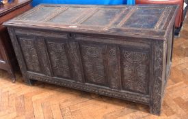 Antique oak coffer carved border to the front, the quadruple framed panelled front with foliate