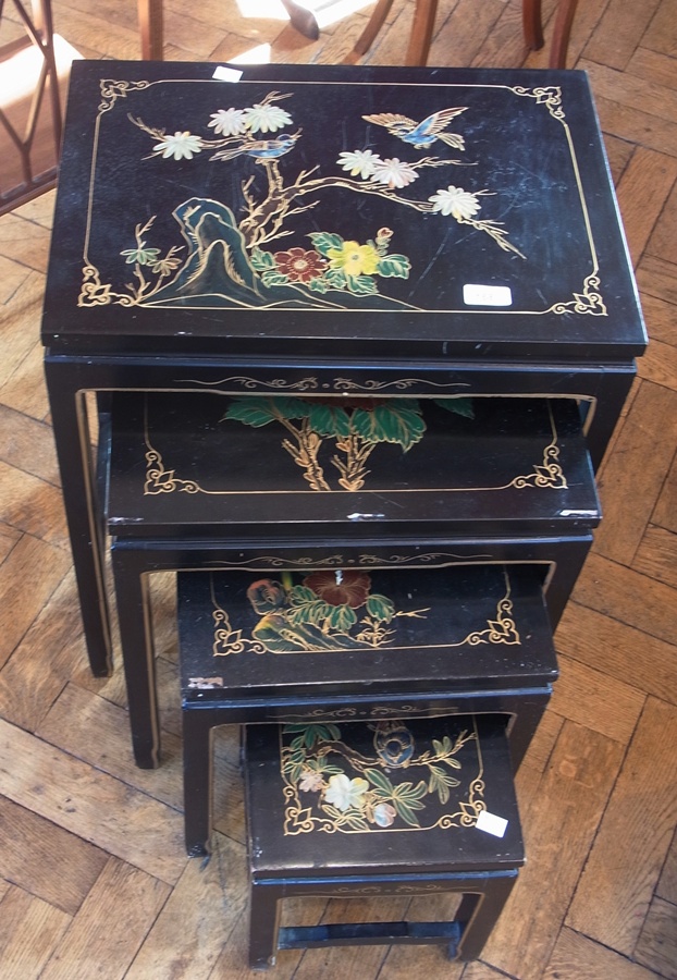 Nest of four reproduction oriental painted and lacquered coffee tables, bird and floral decorated