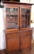 19th century mahogany and stained wood library bookcase, the top with chamfered pediment, having