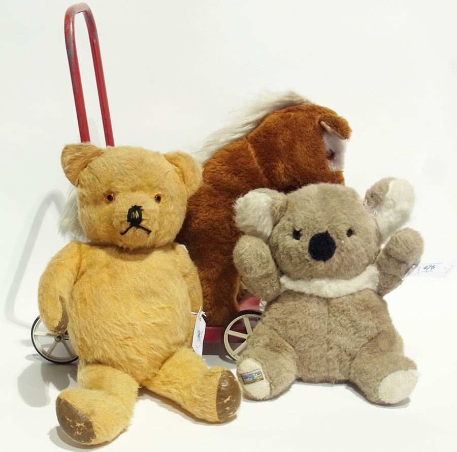 A 1950's Chad Valley teddy bear, with plastic button eyes, a push-along horse and a quantity of