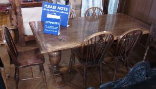 An oak refectory table, on turned bulbous twin supports, united by central stretcher, 183cm long