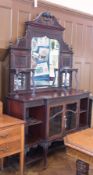 A late Victorian Chippendale style mahogany display cabinet, the bevelled mirror glass back with