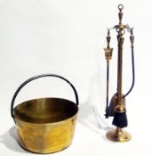 Brass jam pan with iron hoop handle and a brass fireside companion set of five pieces, viz:- stand