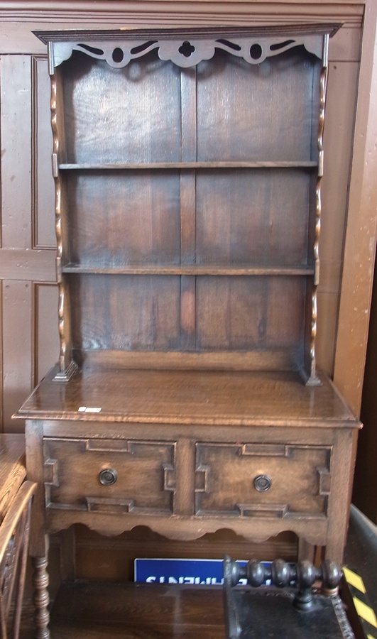 Reproduction oak dresser, with two open shelves to platerack, two moulded front frieze drawers, on