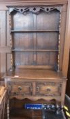 Reproduction oak dresser, with two open shelves to platerack, two moulded front frieze drawers, on