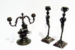 Pair brass candlesticks in form of fauns, 26cm high approximately and a brass candelabrum also in