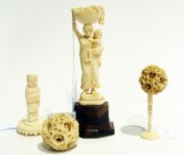 Two carved ivory puzzle balls with stands, Indian carved ivory group, and another carved ivory