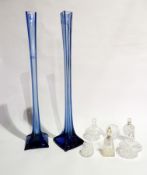 Pair Edwardian blue glass tall vases, each with long square neck and on spreading square base,