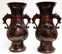 Pair Japanese bronze vases, stepped rim to baluster-shaped body, circular base with lion head