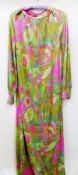 A "Missoni" silk maxi dress in psychedelic colours of pink and green, long sleeves, boat-shaped neck