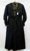 A black Victorian mourning dress, with beaded and lace decorations to the bodice, with pintucks