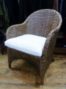 Modern wicker armchair, with cushion, height 87cm approx.