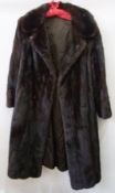 A 1970's ranch mink coat, half belt at the back, embroidered buttons to the sleeves and front
