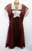 A Poplin vintage brown dress with white chiffon sleeves and collar with bow to bodice with a brown