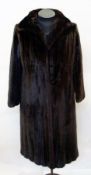 A Blackglama full length dark mink coat, labelled "Grosvenor, Canada, Exclusive to Harrods"