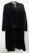 A vintage black sealskin coat, labelled "Lister's Seal", with button details and full collar