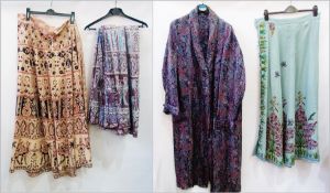 A Paisley dressing gown, two ethnic wraparound skirts and an embroidered wool skirt (4)