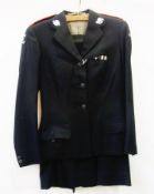 A St. John Ambulance female suit, jacket and skirt in black wool with silver St. John Ambulance