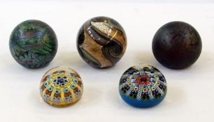 An Isle of Wight glass paperweight, two other similar and two millefiori paperweights (5)