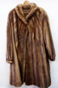 A full length mink coat with puff sleeves, a rounded collar (purchased in Italy)