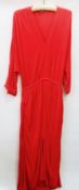 A Balenciaga red batwing sleeved dress with elasticated waist in silk jersey