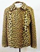 A leopard skin fur jacket, labelled "Madame Louise, Nairobi"